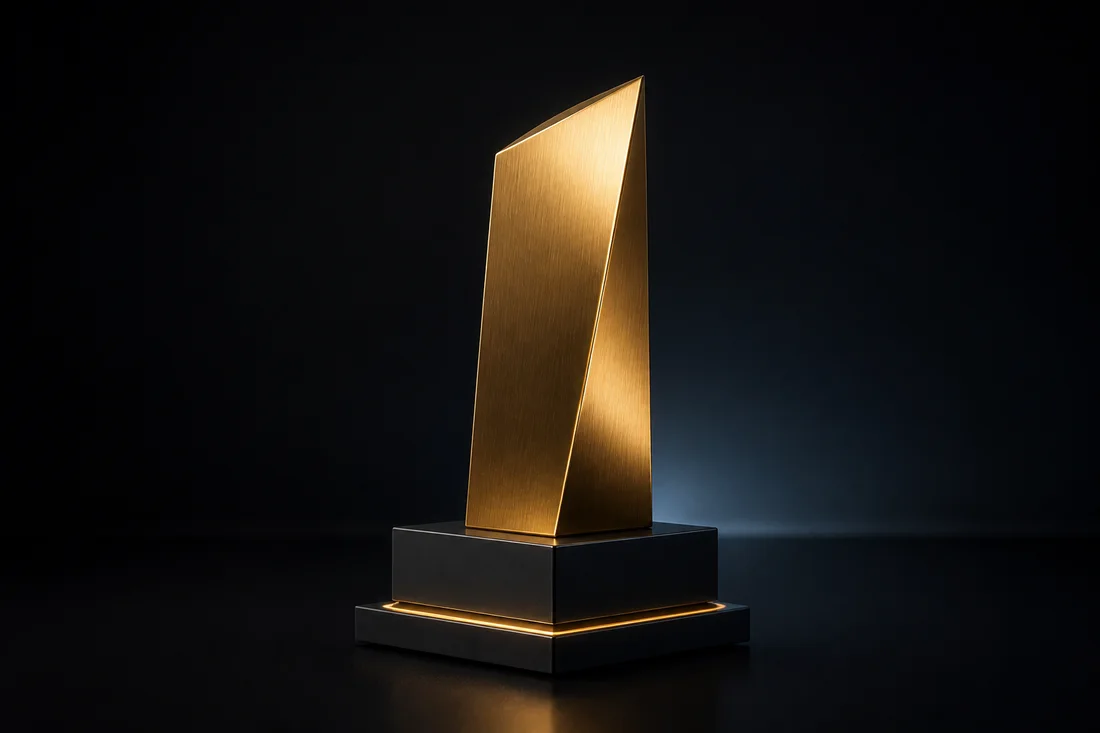 Minimal gold innovation award on a dark studio plinth